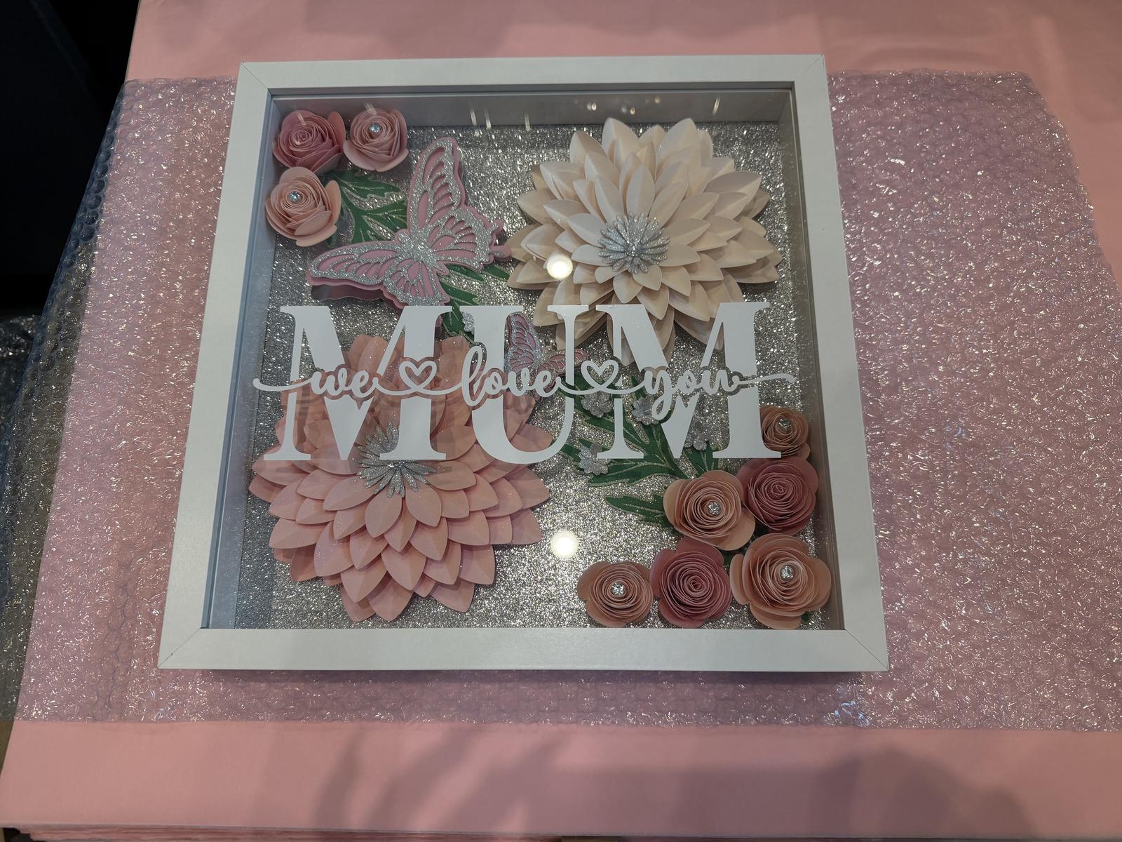 Shadowbox with hand rolled flowers 